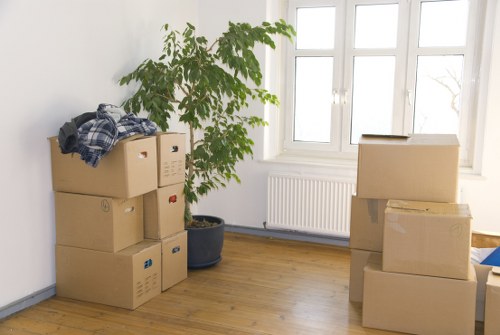 Boxes and furniture loaded into a van during a suburban house removal