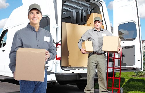 Modern van handling customer belongings in Acton